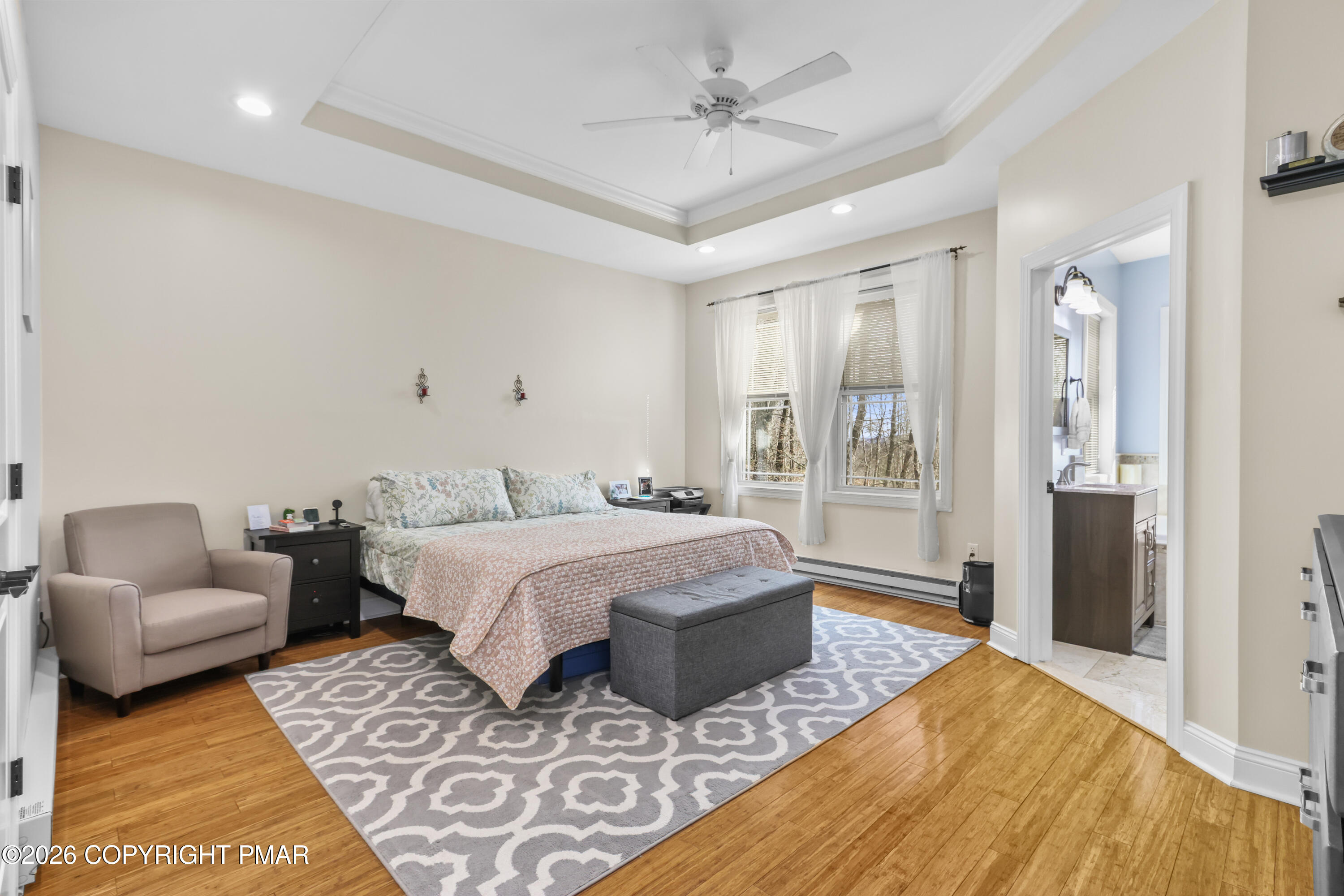 1007 Hampstead Road Bushkill, PA 18324 - Photo 15 of 68 a spacious bedroom with a bed a couch and a window