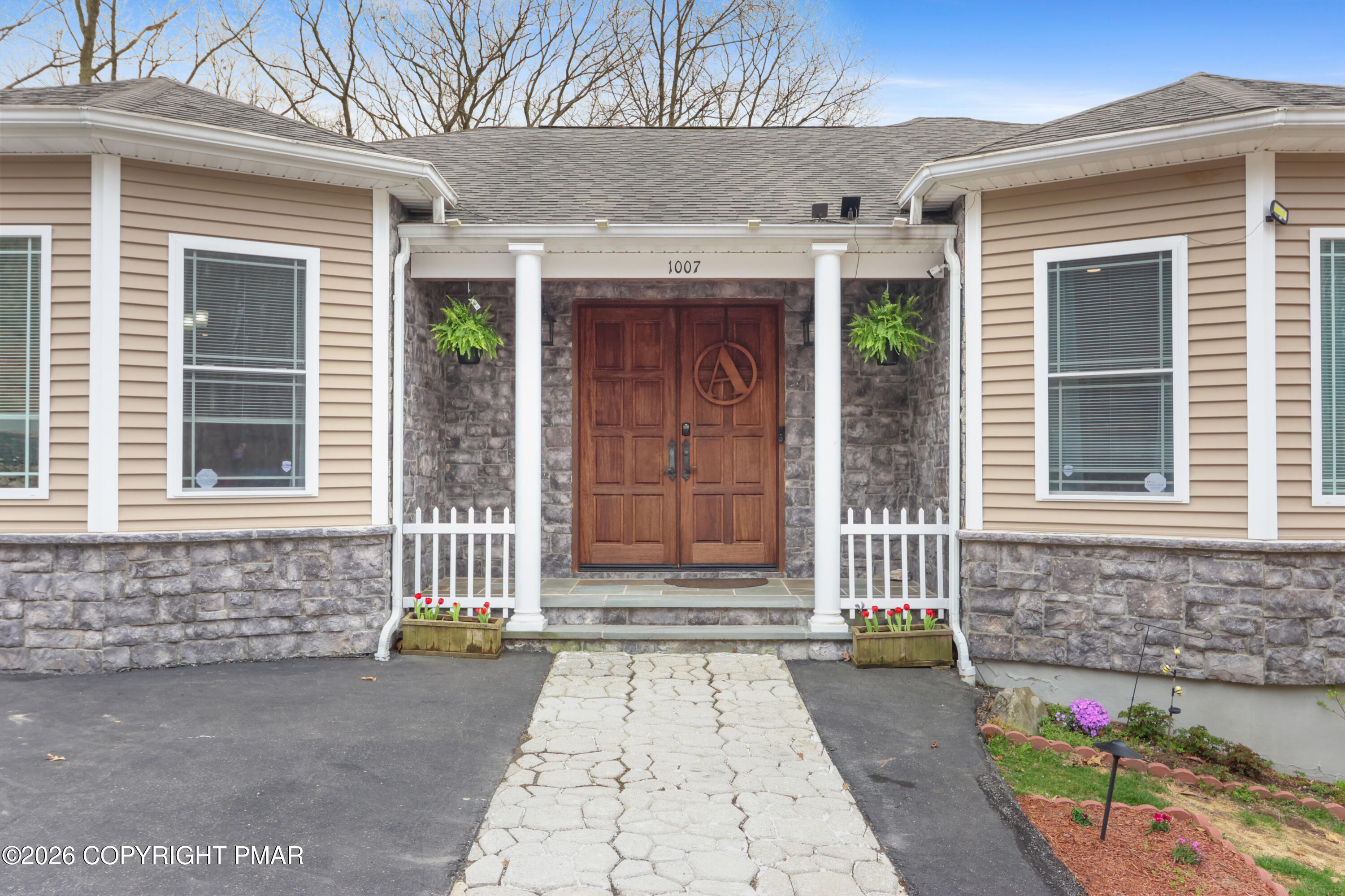 1007 Hampstead Road Bushkill, PA 18324 - Photo 2 of 68 a front view of a house with a garage