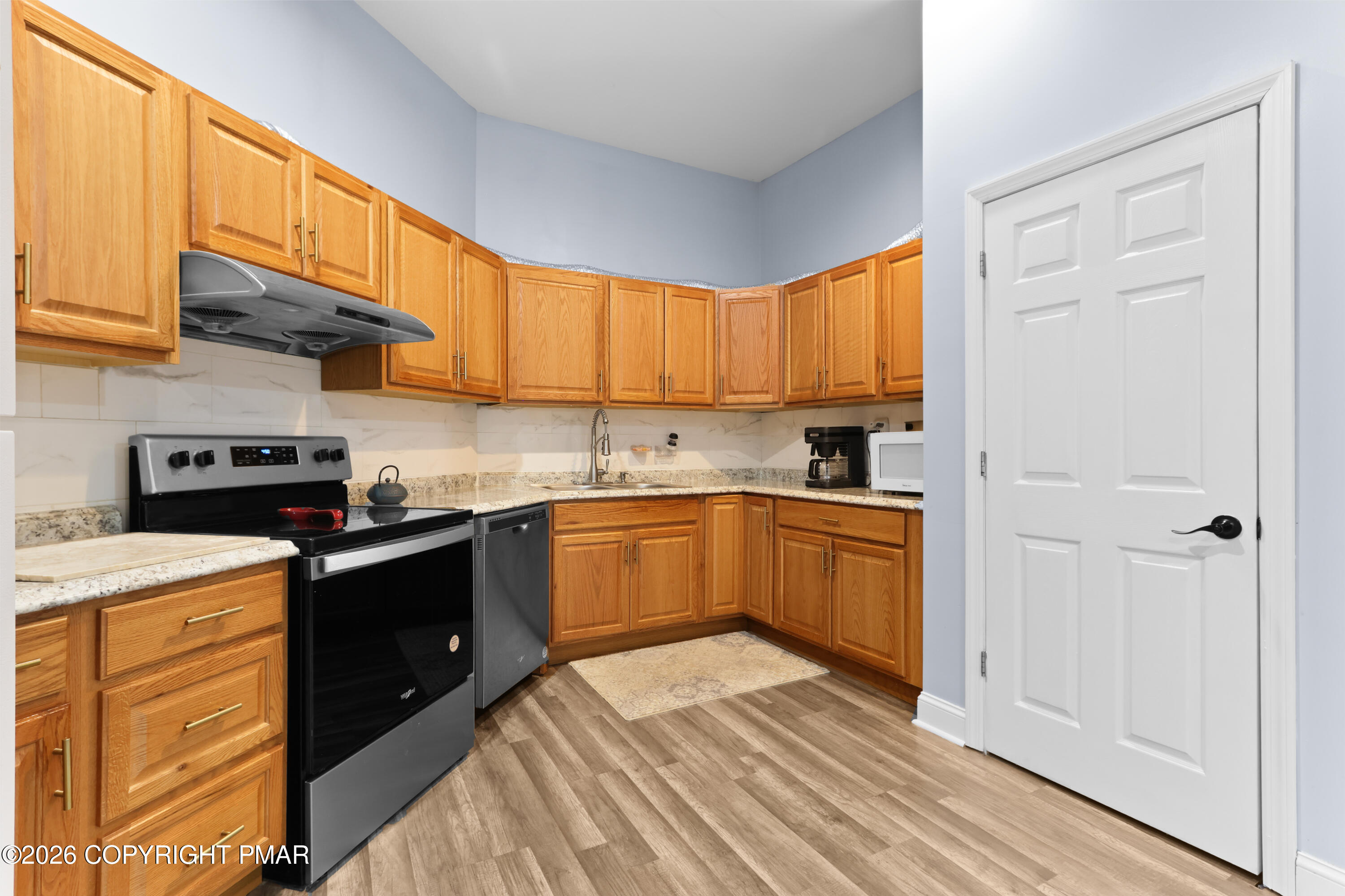 1007 Hampstead Road Bushkill, PA 18324 - Photo 28 of 68 a kitchen with a sink window and cabinets
