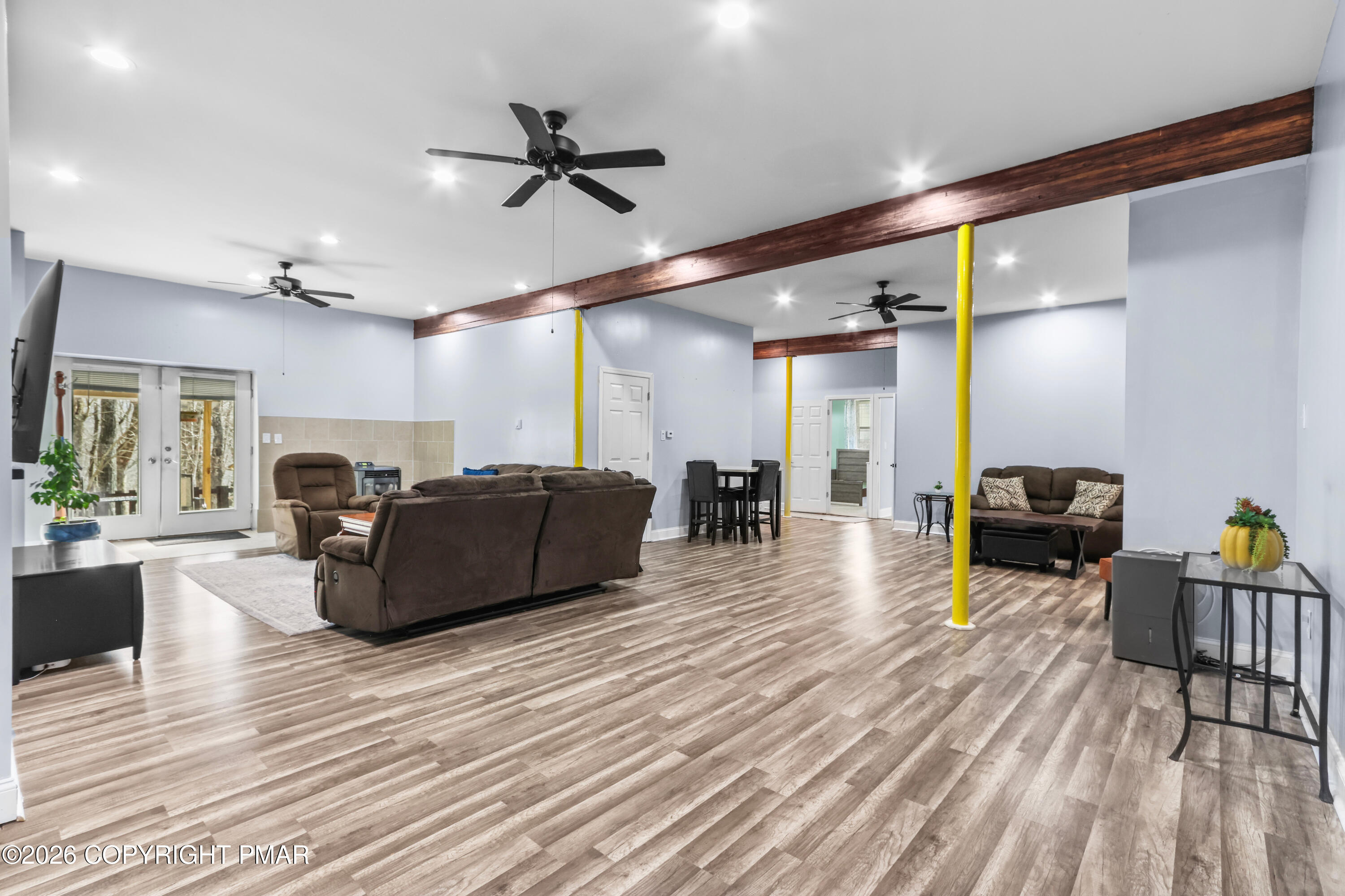 1007 Hampstead Road Bushkill, PA 18324 - Photo 29 of 68 a living room with furniture and a wooden floor