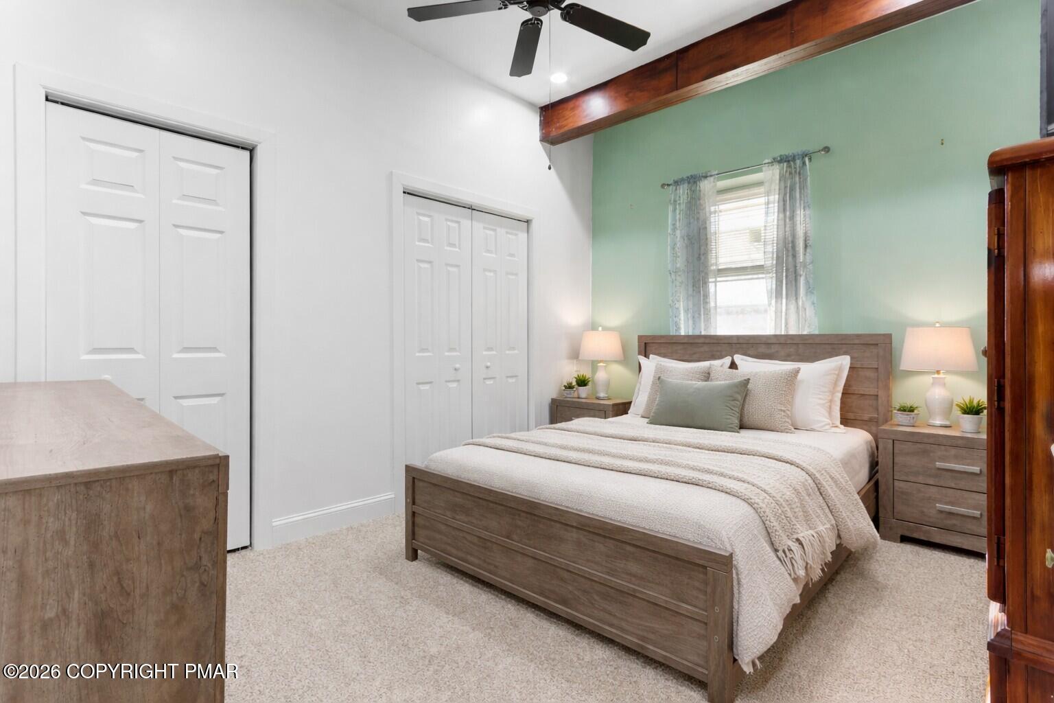 1007 Hampstead Road Bushkill, PA 18324 - Photo 40 of 68 a bedroom with a bed and a chandelier