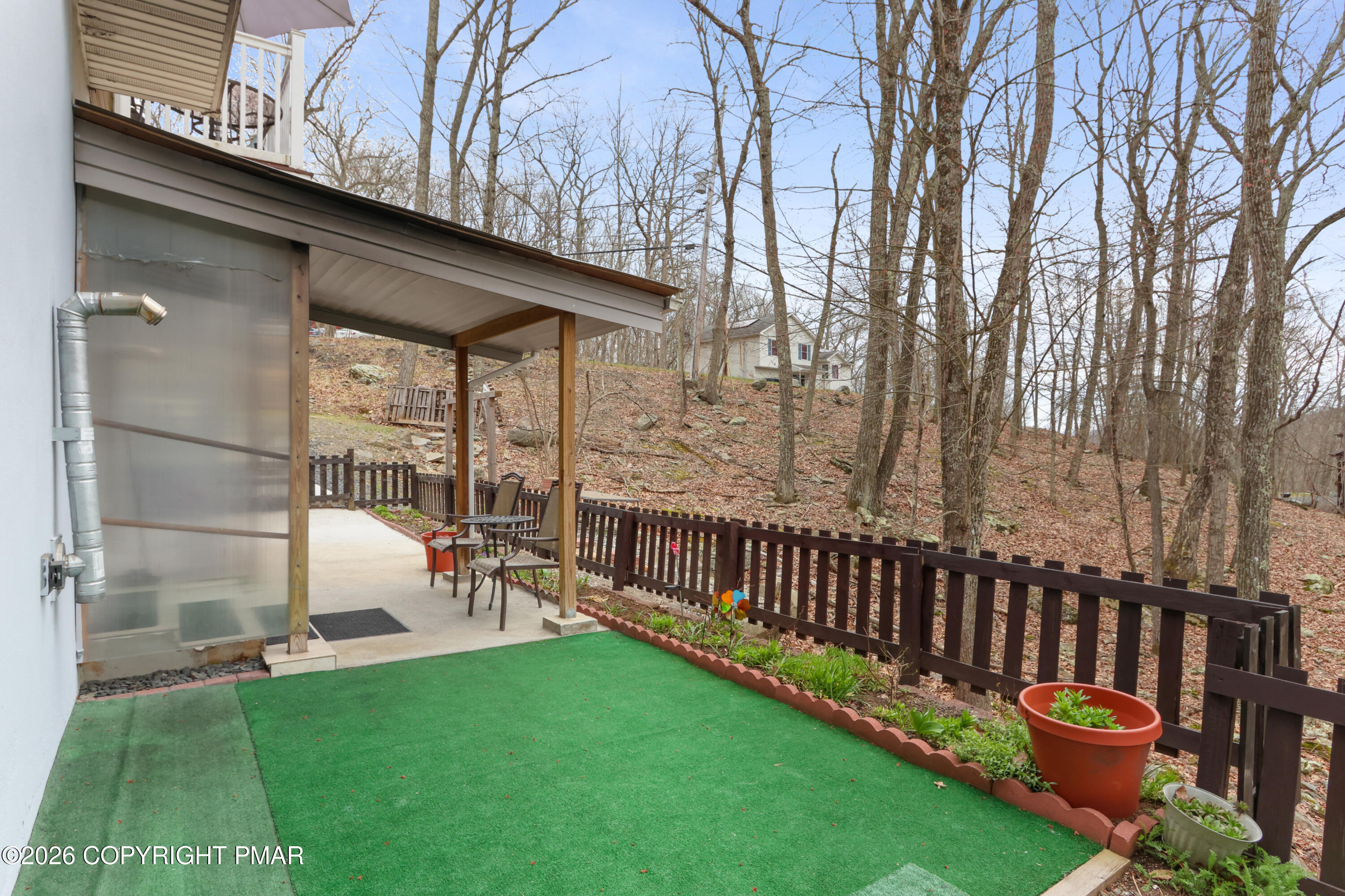 1007 Hampstead Road Bushkill, PA 18324 - Photo 42 of 68 a view of a chair and table on the deck