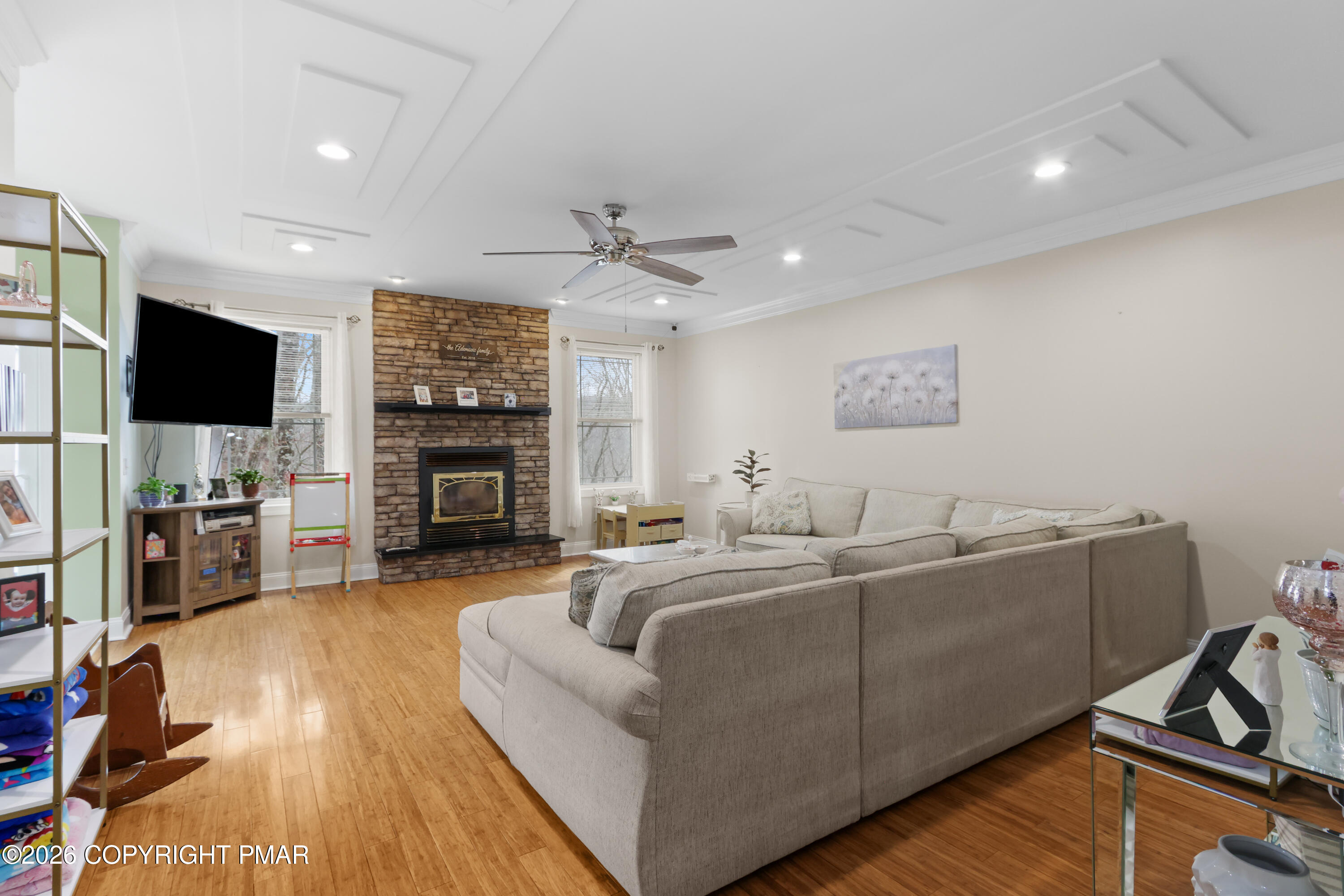 1007 Hampstead Road Bushkill, PA 18324 - Photo 6 of 68 a living room with furniture a fireplace and a flat screen tv