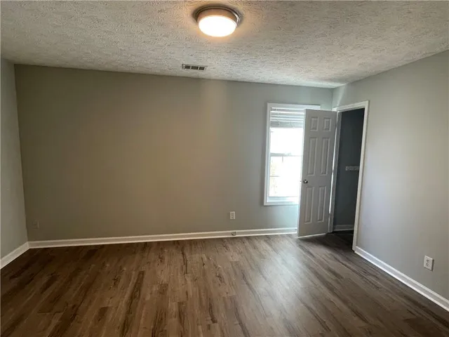 a view of yard with wooden fence