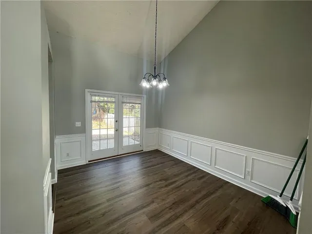 a kitchen with stainless steel appliances granite countertop a stove top oven a refrigerator a sink and dishwasher