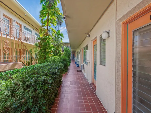 a view of a pathway both side of house