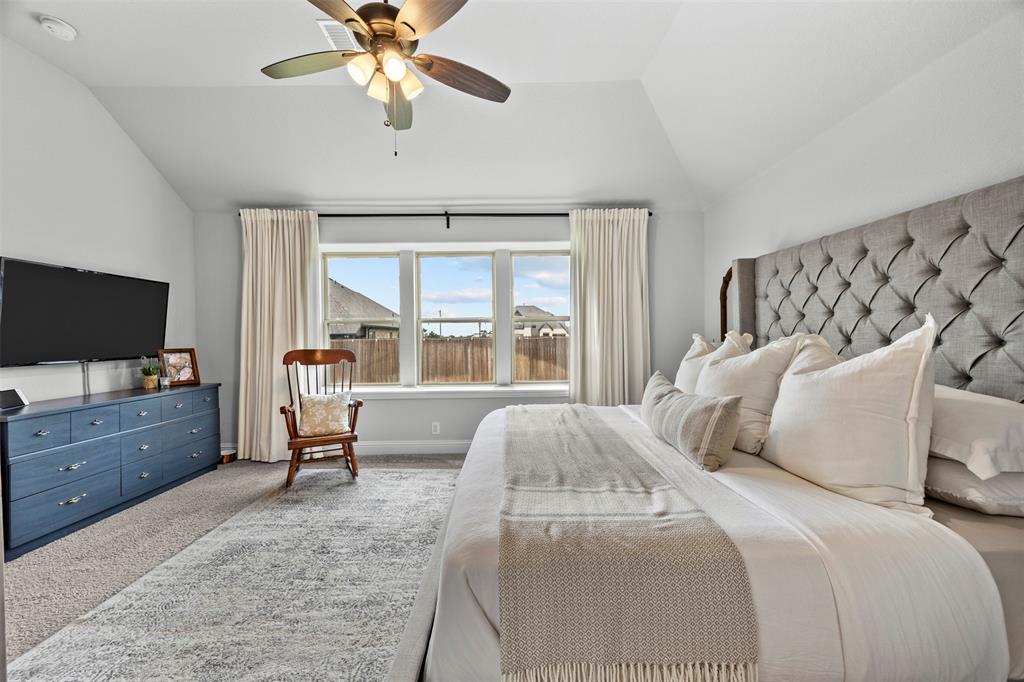 1084 Imperial Eagle Road Alvarado, TX 76009 - Photo 27 of 39 a bedroom with a bed and a flat screen tv