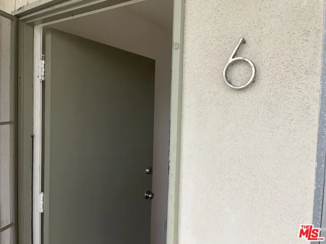 a bathroom with a shower and a mirror