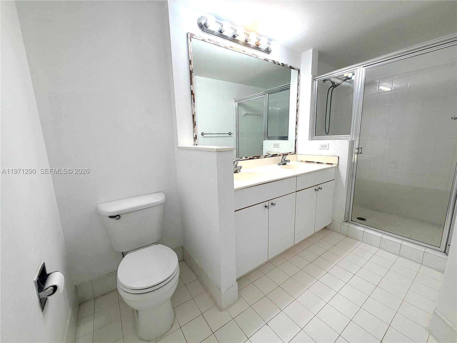 17150 North Bay Road, Unit 2911 Sunny Isles Beach, FL 33160 - Photo 13 of 43 a bathroom with a sink a toilet and shower