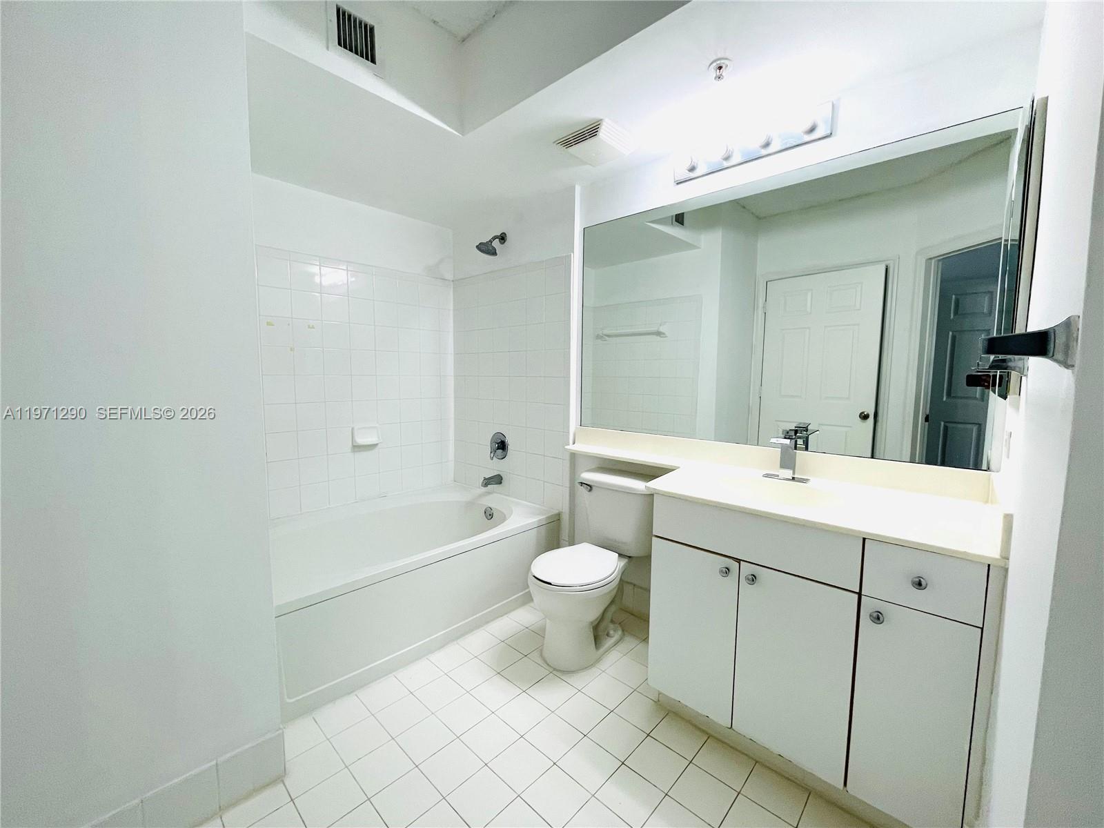 17150 North Bay Road, Unit 2911 Sunny Isles Beach, FL 33160 - Photo 15 of 43 a bathroom with a double vanity sink mirror and toilet
