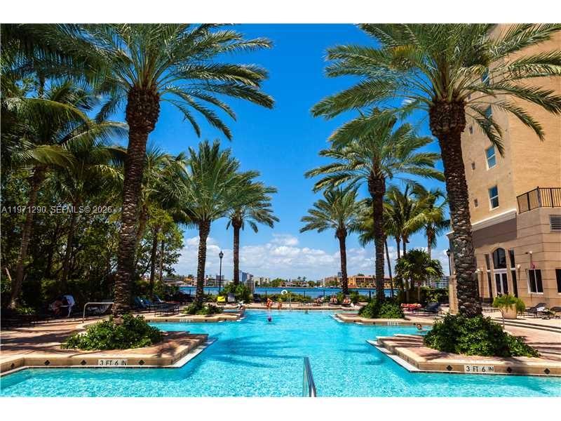 17150 North Bay Road, Unit 2911 Sunny Isles Beach, FL 33160 - Photo 17 of 43 a view of a house with swimming pool and sitting area