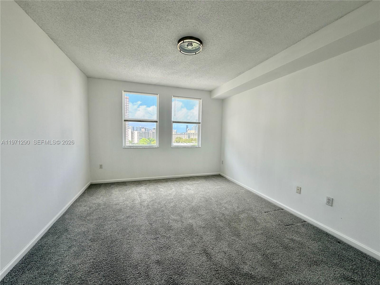 17150 North Bay Road, Unit 2911 Sunny Isles Beach, FL 33160 - Photo 35 of 43 an empty room with windows