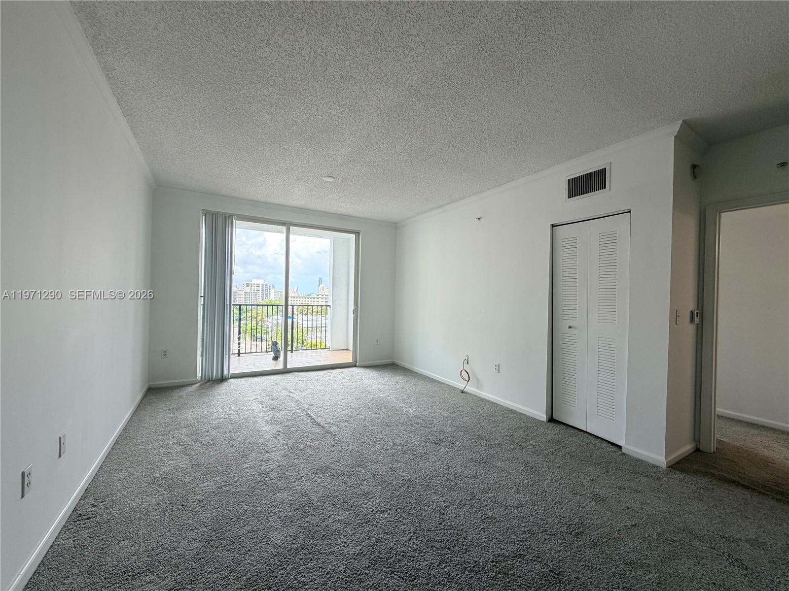 17150 North Bay Road, Unit 2911 Sunny Isles Beach, FL 33160 - Photo 41 of 43 a view of a big room with windows and chandelier fan