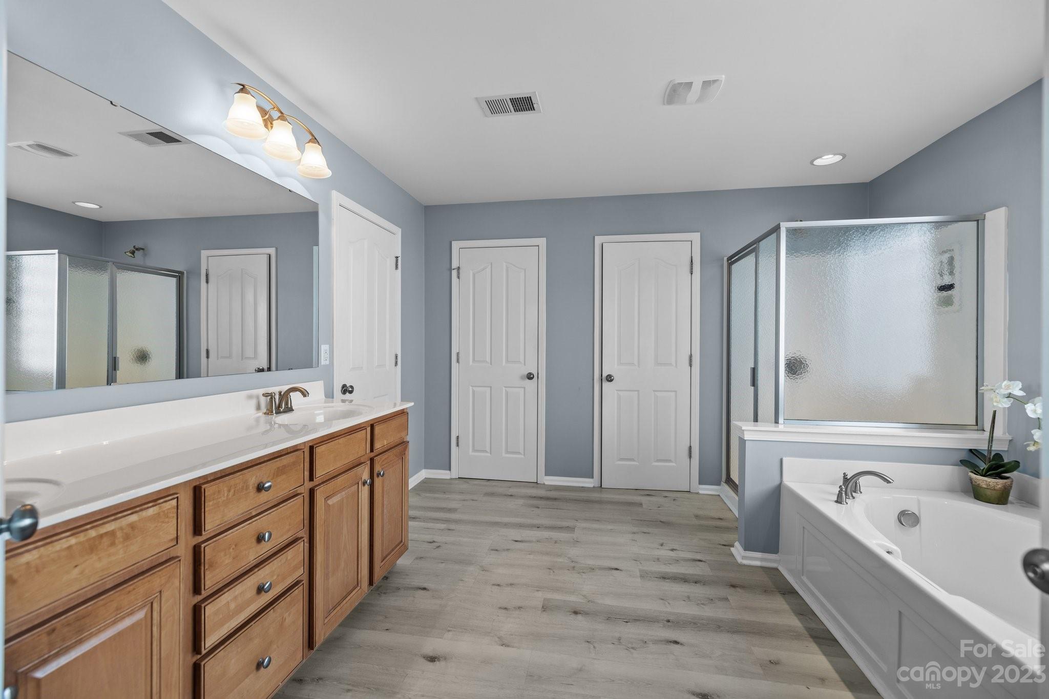 309 Ayers Road Fort Mill, SC 29715 - Photo 25 of 38 a large bathroom with a large tub shower sink and mirror