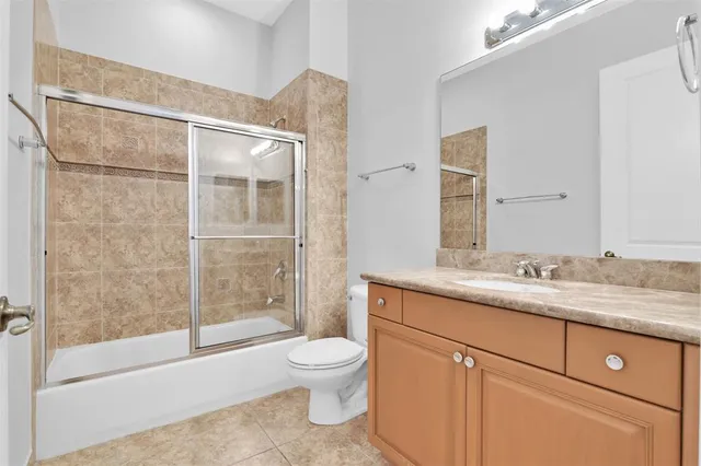 an empty room with chandelier fan