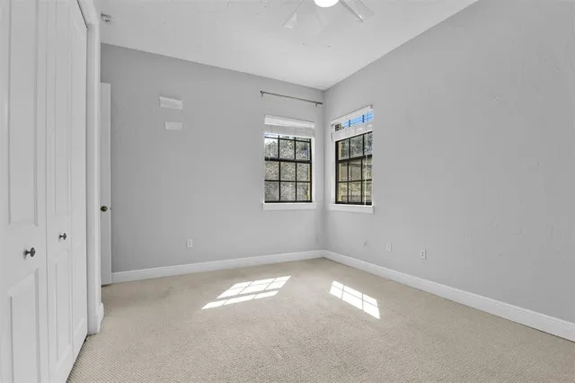 a kitchen with granite countertop a sink a counter top space appliances and cabinets