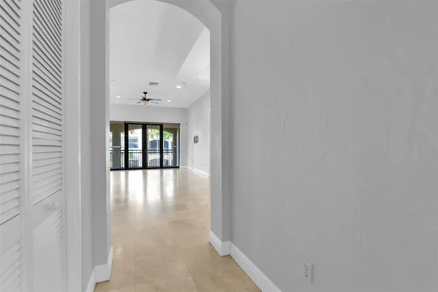 a large kitchen with kitchen island a chandelier