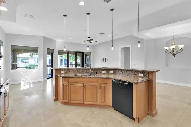 a bathroom with a granite countertop sink mirror and shower