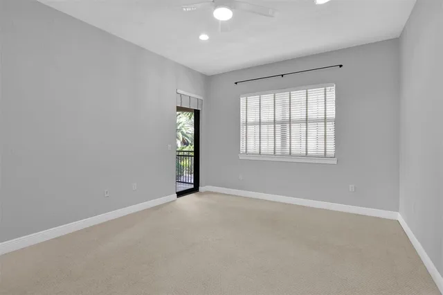 a view of a patio with table and chairs and potted plants