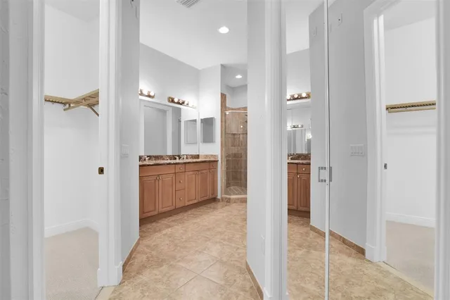 a view of a patio with table and chairs and potted plants