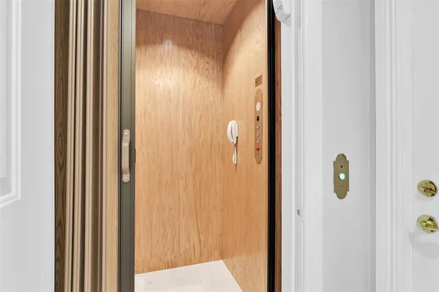 an entryway in a hall with a window