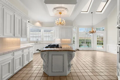 a view of empty room with fireplace and wooden floor