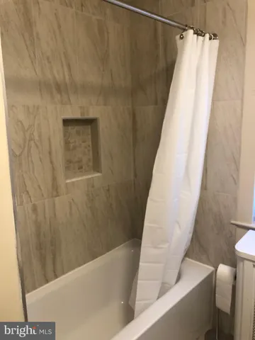 a view of a bathtub in a bathroom