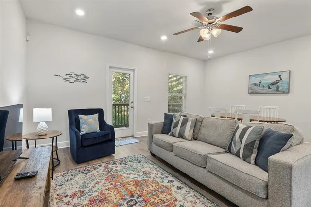 a living room with furniture and a lamp