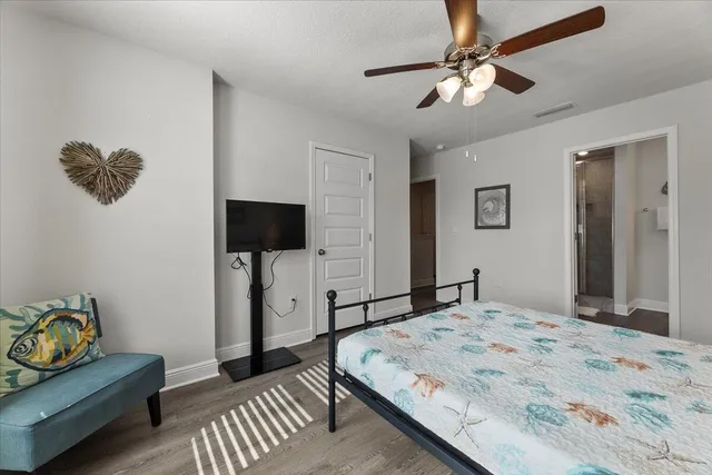 a bedroom with a bed and a television