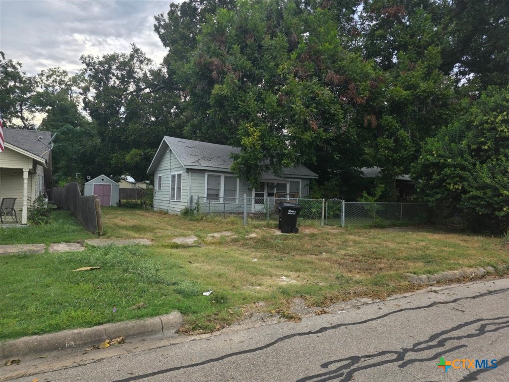 1214 South 19th Street Temple, TX 76504 - Photo 2 of 11 a backyard of a house with table and chairs