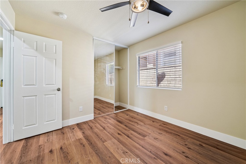 7271 Venosa Place Rancho Cucamonga, CA 91701 - Photo 11 of 32 wooden floor in an empty room with a window