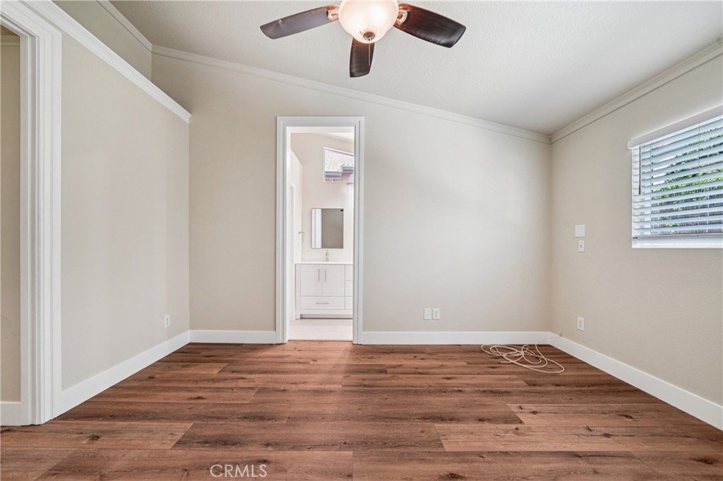 7271 Venosa Place Rancho Cucamonga, CA 91701 - Photo 15 of 32 a view of empty room with wooden floor and fan
