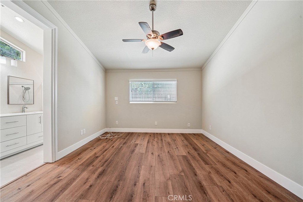 7271 Venosa Place Rancho Cucamonga, CA 91701 - Photo 16 of 32 wooden floor in an empty room with a window