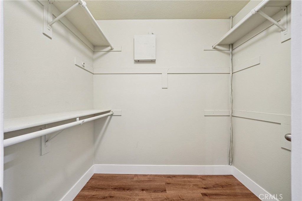 7271 Venosa Place Rancho Cucamonga, CA 91701 - Photo 17 of 32 a view of a room with racks on the wall