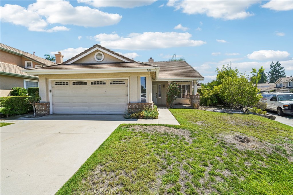 7271 Venosa Place Rancho Cucamonga, CA 91701 - Photo 2 of 32 a front view of a house with garden