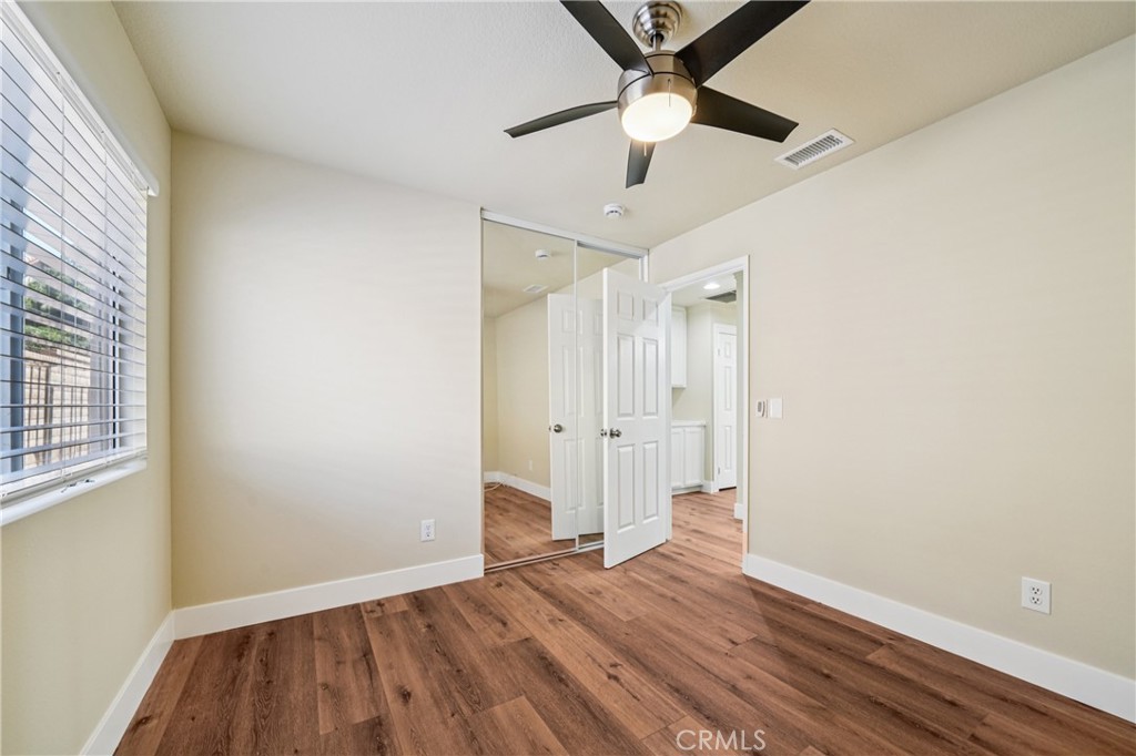 7271 Venosa Place Rancho Cucamonga, CA 91701 - Photo 21 of 32 wooden floor in an empty room with a window