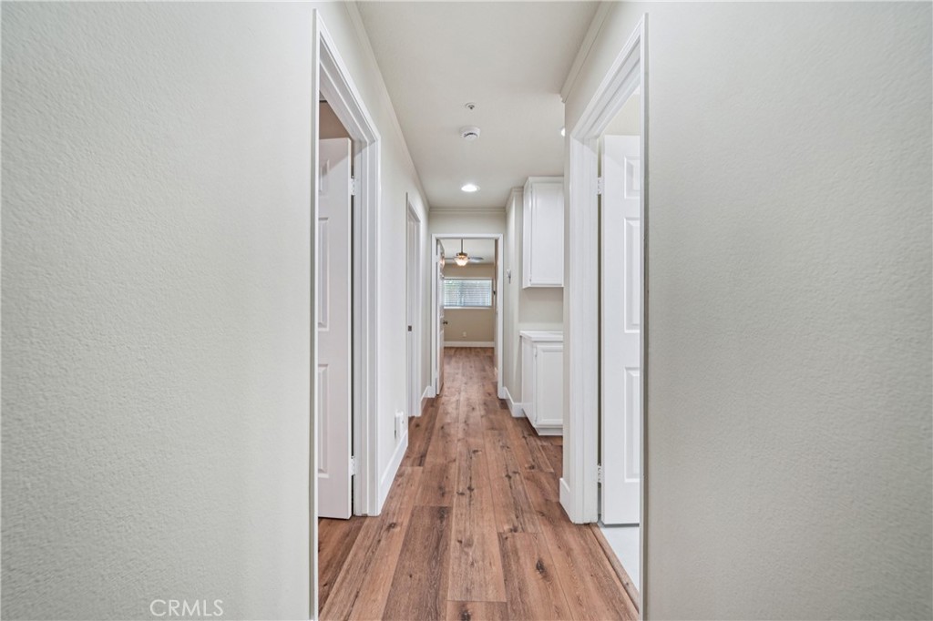 7271 Venosa Place Rancho Cucamonga, CA 91701 - Photo 23 of 32 a view of a hallway with wooden floor and staircase