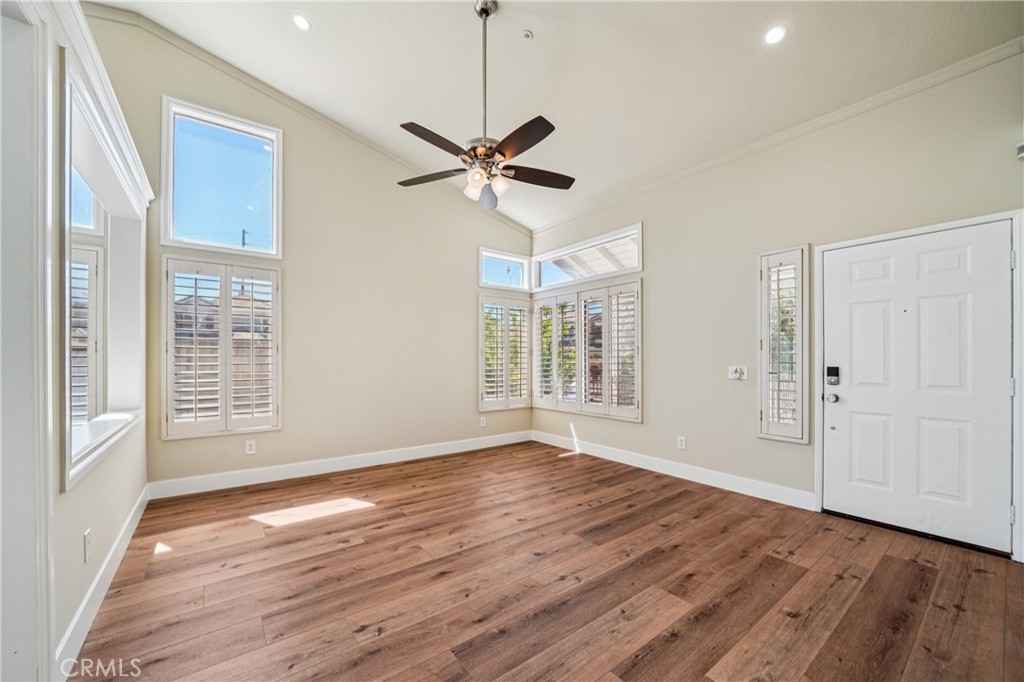 7271 Venosa Place Rancho Cucamonga, CA 91701 - Photo 4 of 32 a view of an empty room with wooden floor and a window