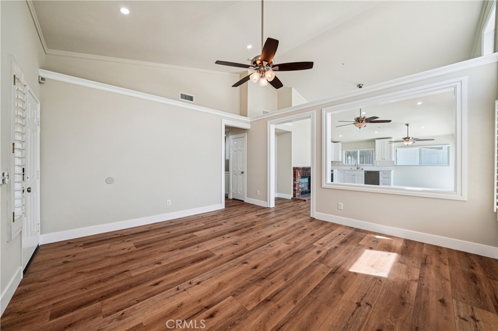 7271 Venosa Place Rancho Cucamonga, CA 91701 - Photo 5 of 32 a view of empty room with wooden floor and fan