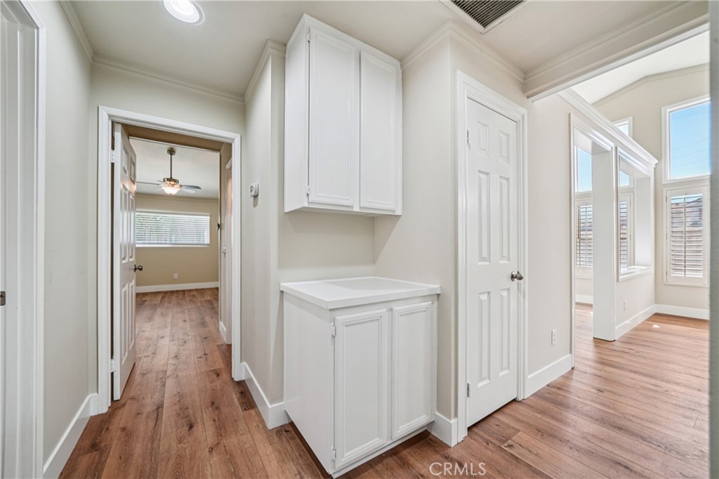 7271 Venosa Place Rancho Cucamonga, CA 91701 - Photo 9 of 32 a view of a hallway with wooden floor