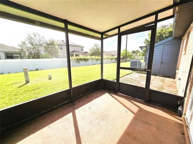 a view of an empty room with a large window