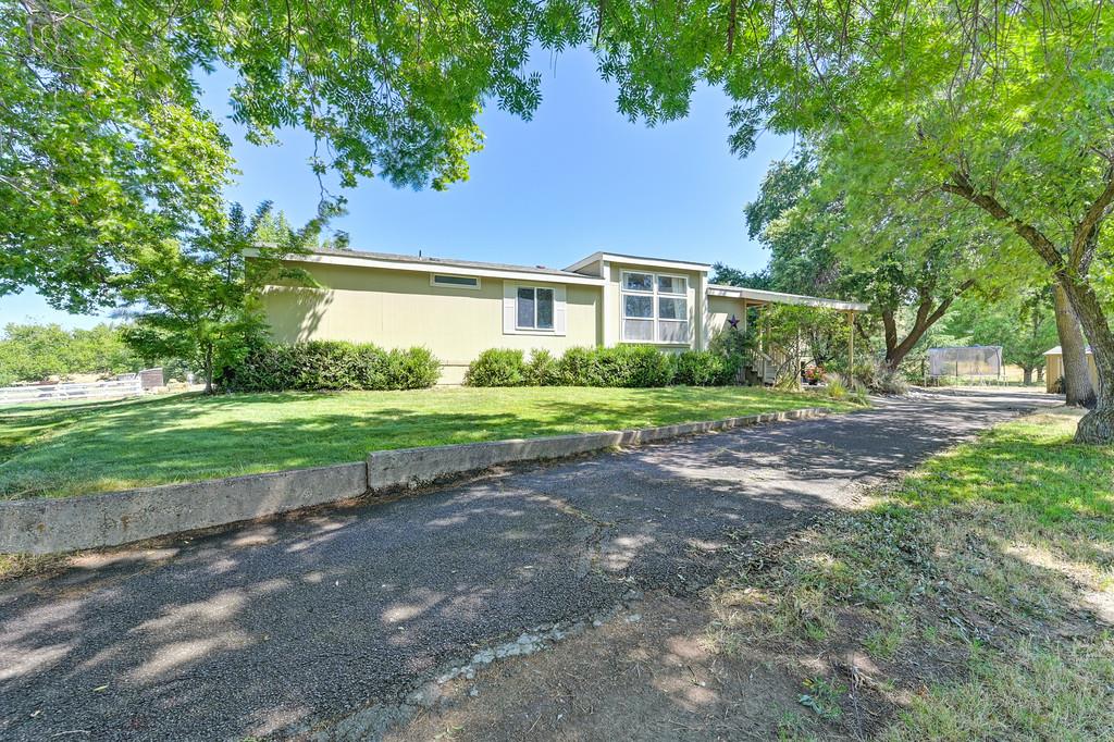 1200 Gold Hill Road Newcastle, CA 95658 - Photo 24 of 96 a front view of a house with a yard and trees