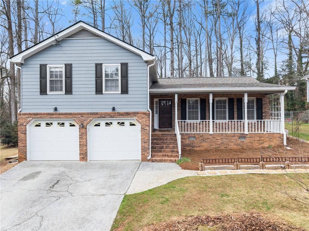 4691 Lucerne Valley Road Southwest Lilburn, GA 30047 - Photo 1 of 55 a view of a house with a yard