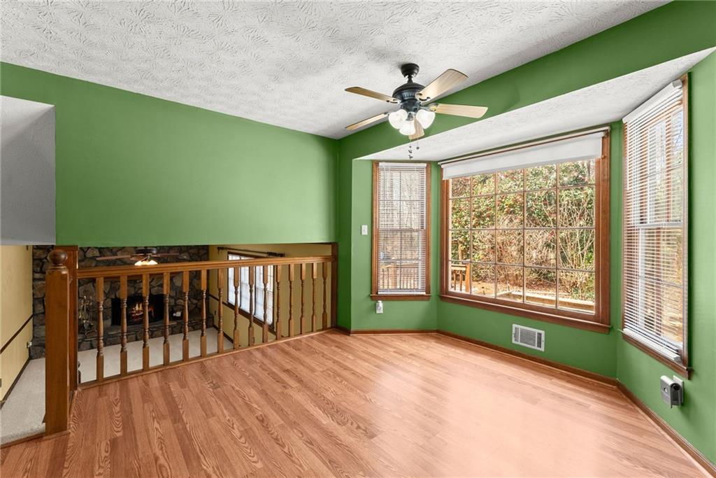 4691 Lucerne Valley Road Southwest Lilburn, GA 30047 - Photo 15 of 55 a view of livingroom with window and hardwood floor
