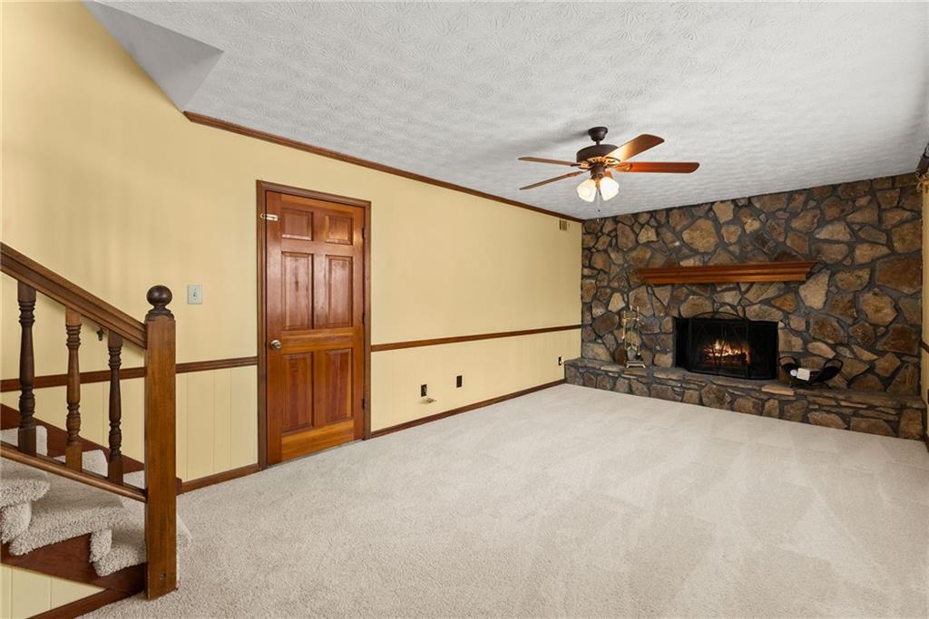 4691 Lucerne Valley Road Southwest Lilburn, GA 30047 - Photo 18 of 55 a view of an empty room with a fireplace