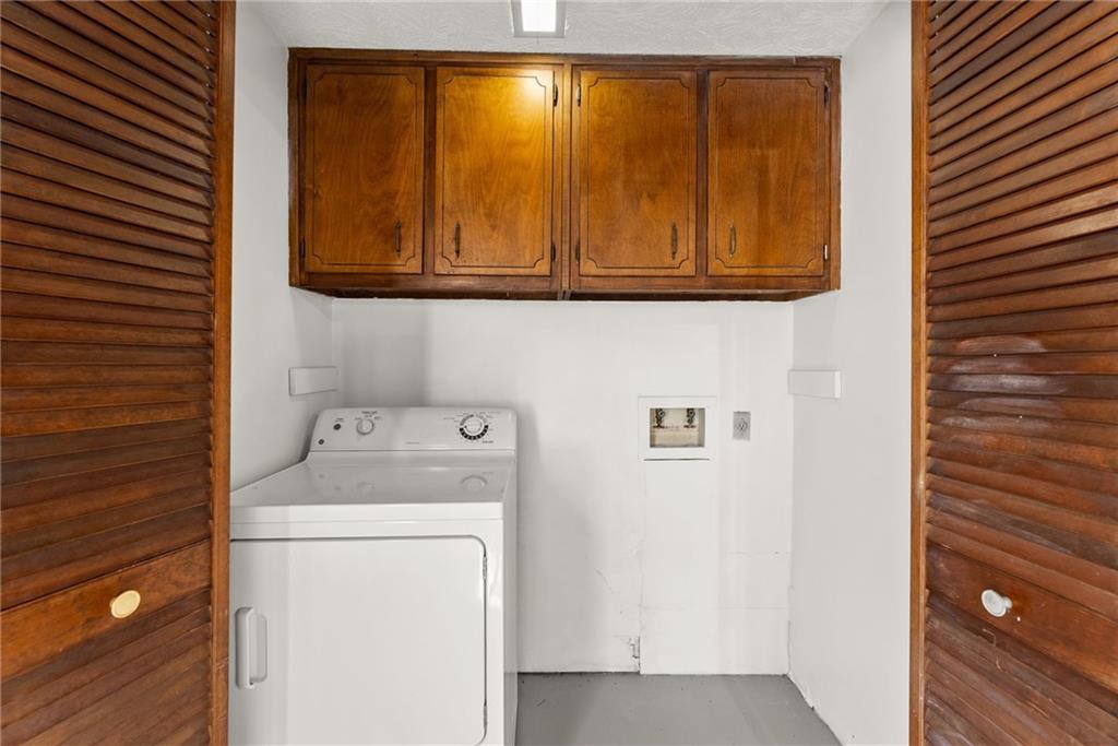 4691 Lucerne Valley Road Southwest Lilburn, GA 30047 - Photo 20 of 55 a utility room with dryer and washer