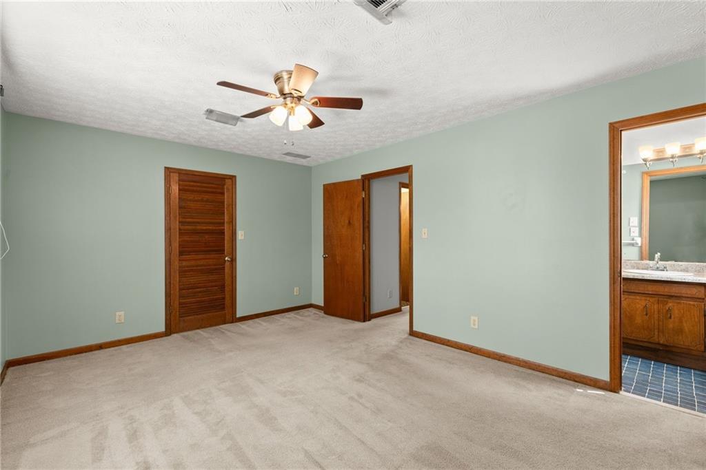 4691 Lucerne Valley Road Southwest Lilburn, GA 30047 - Photo 24 of 55 a view of an empty room with window and cabinet