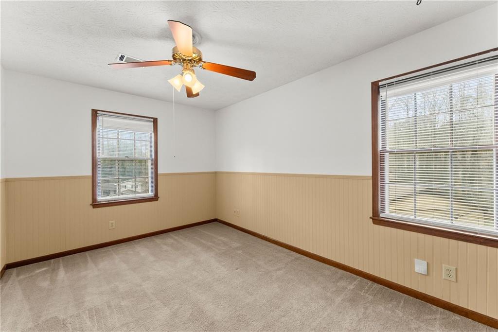 4691 Lucerne Valley Road Southwest Lilburn, GA 30047 - Photo 28 of 55 a view of an empty room with a window
