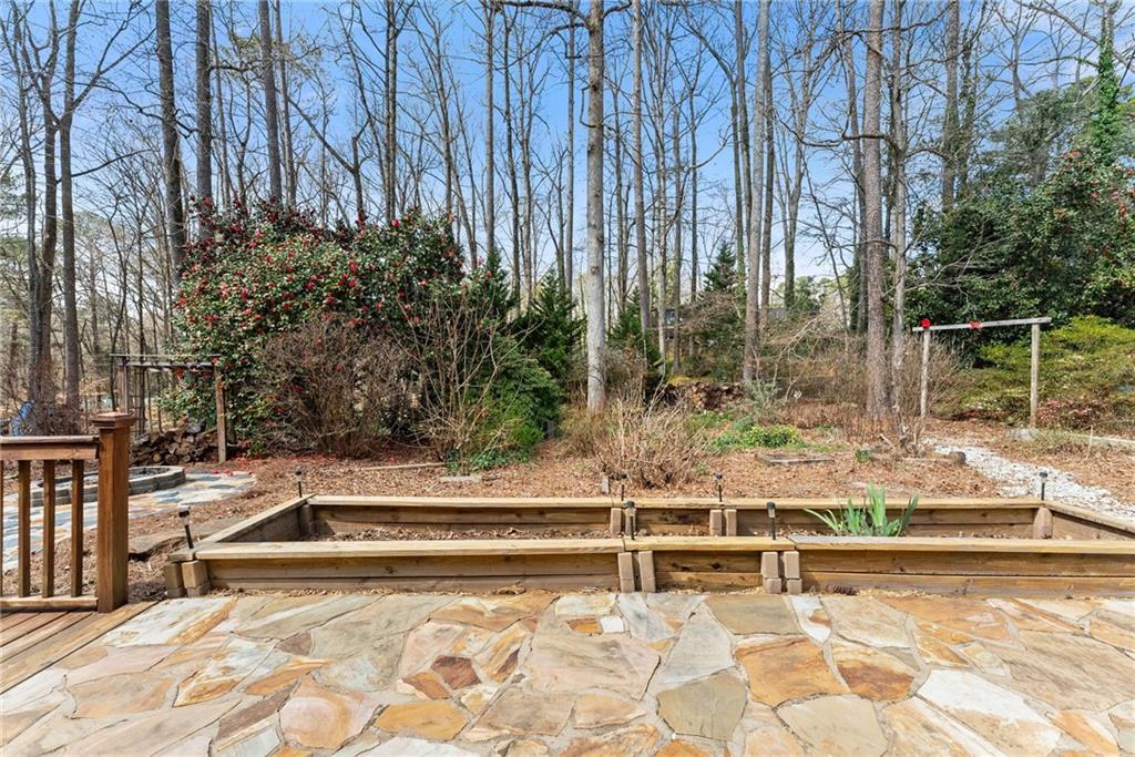 4691 Lucerne Valley Road Southwest Lilburn, GA 30047 - Photo 34 of 55 a view of swimming pool with lawn chairs and plants