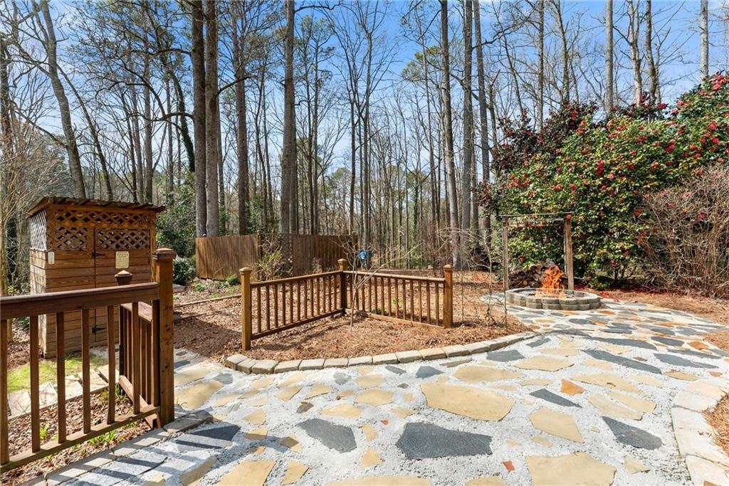4691 Lucerne Valley Road Southwest Lilburn, GA 30047 - Photo 36 of 55 a view of a bench with wooden fence